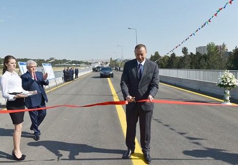 Ilham Aliyev attends opening of bridge and road in Baku  - PHOTOS